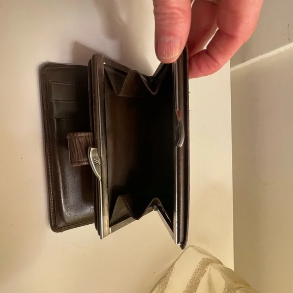 Louis Vuitton wallet. Dark brown in good condition.
